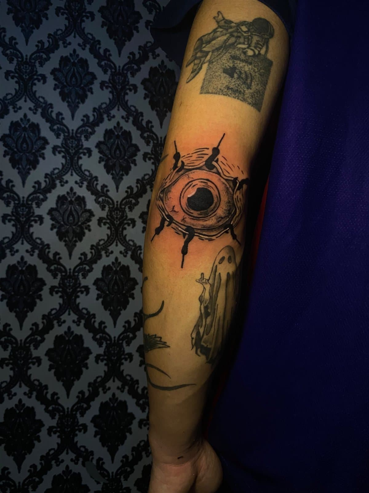 Astronaut, eye & ghost, forearm