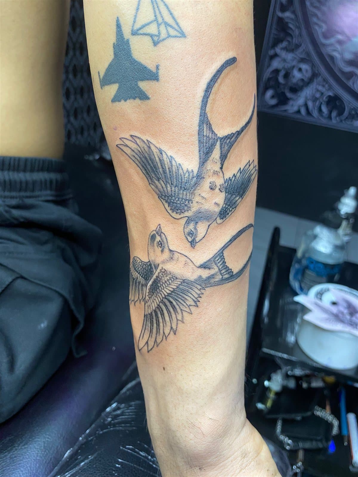 Fine line swallows, forearm