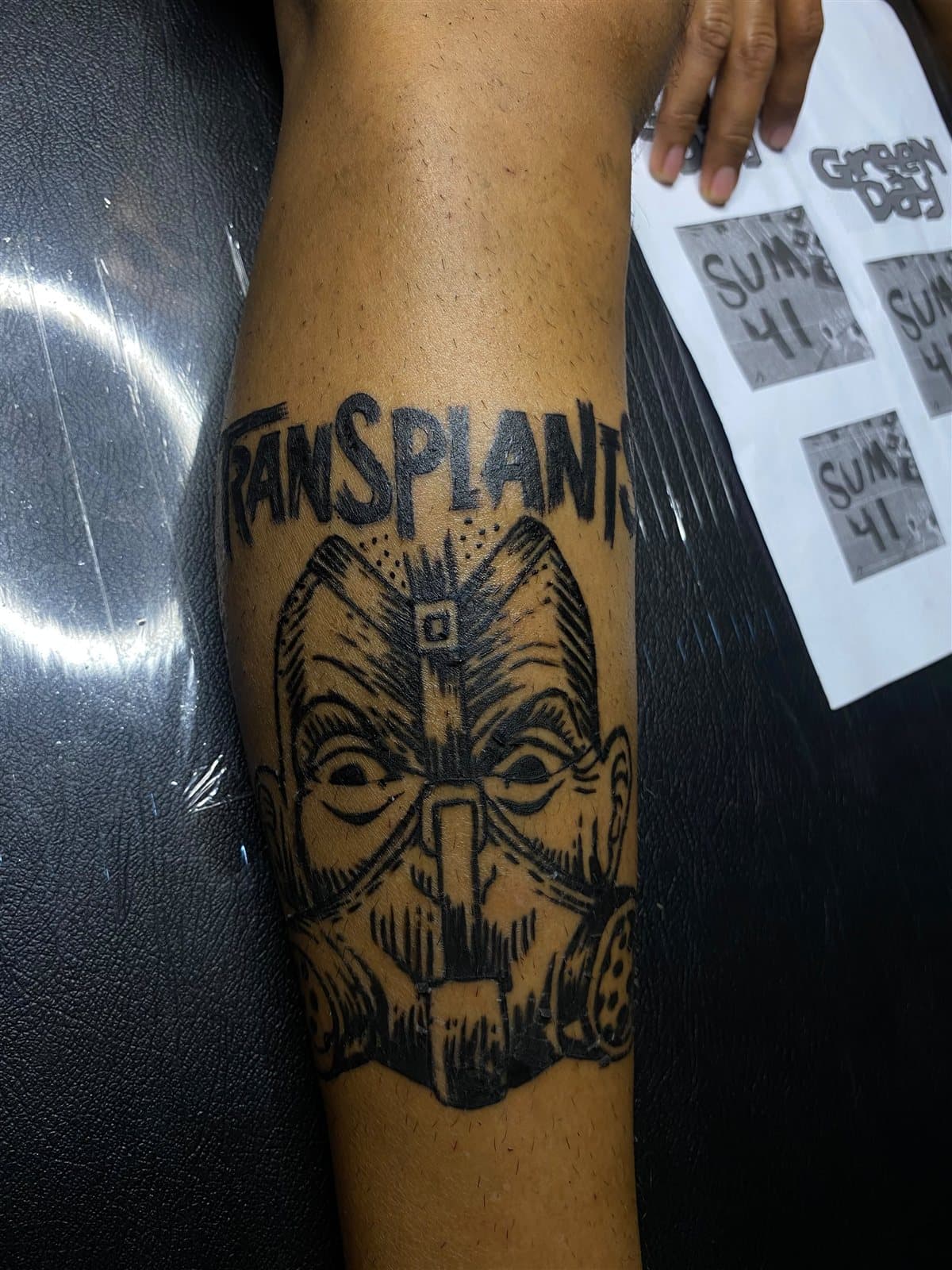 Traditional skull mask & lettering, forearm